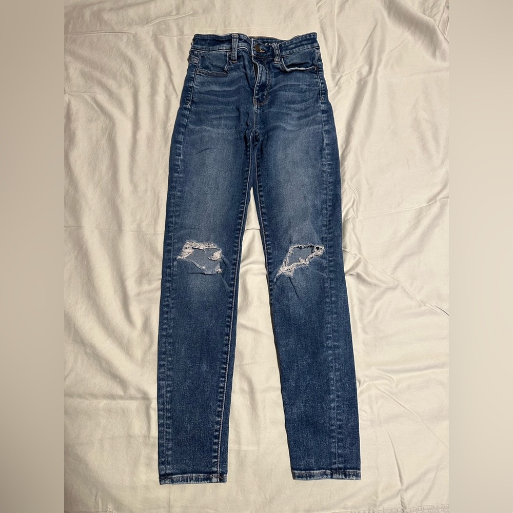 knee ripped denim jeans